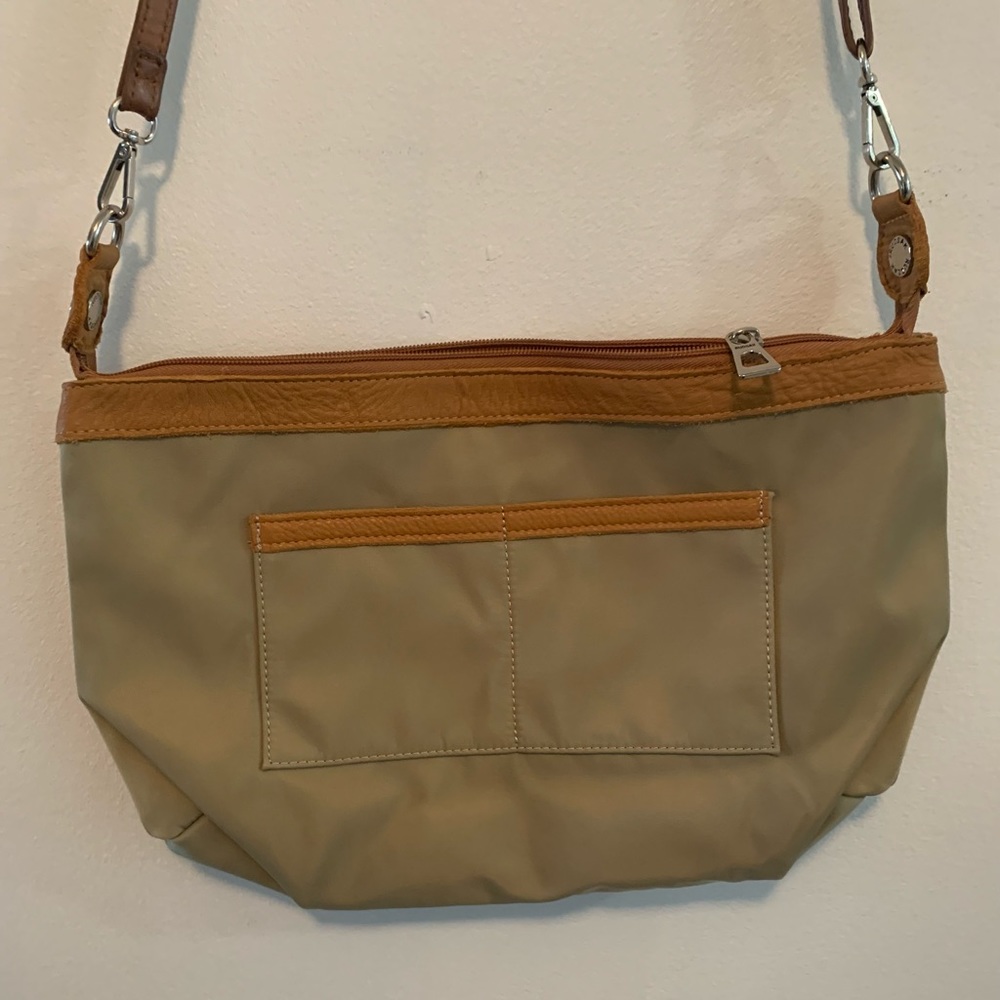 Preowned Rudsak cross bag with adjustable strap.
